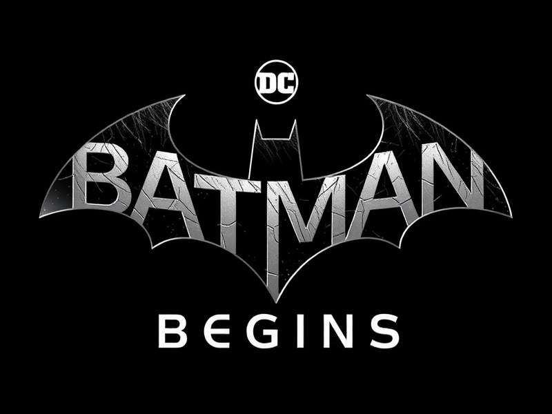 Batman Begins Logo — dark metallic bat emblem on black background